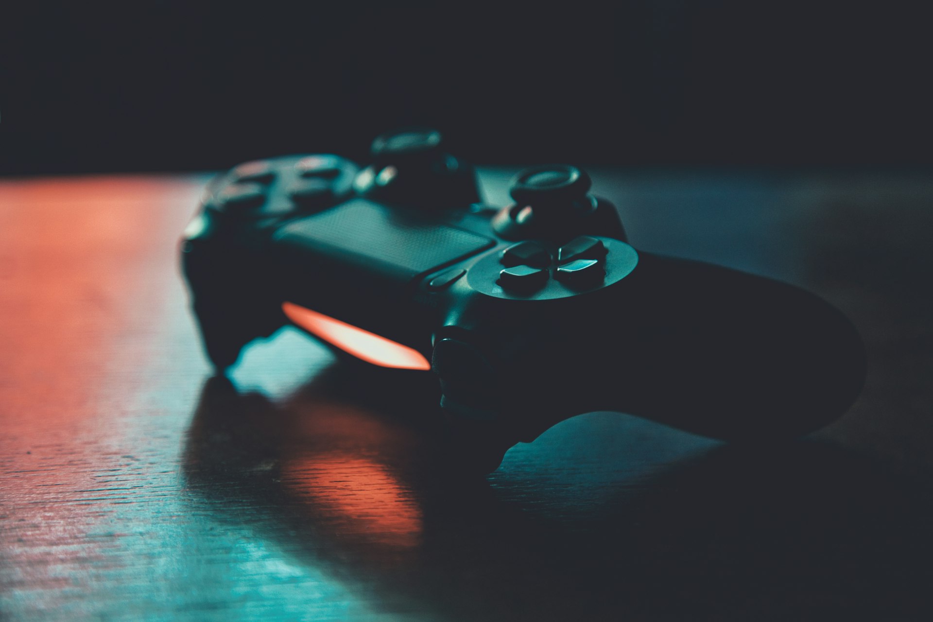 Close up of an esports gaming keyboard and mouse with glowing neon pink accents on a dark ash desk, highly detailed, photorealistic